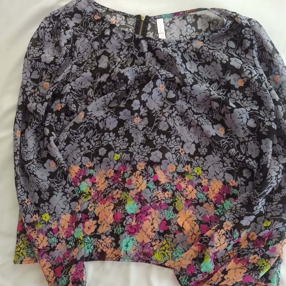 Two beautiful woman's sheer floral print blouses